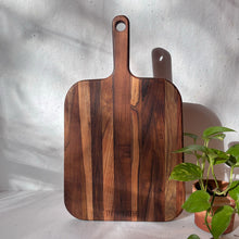Load image into Gallery viewer, Top view of handcrafted teak wood chopping board with handle from InBreathe, ideal for kitchen use and vegetable cutting