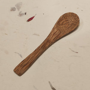 Reusable spoon made from reclaimed coconut wood — a sustainable alternative to plastic cutlery.