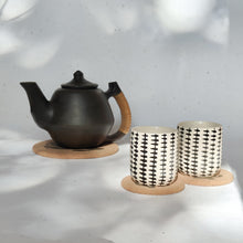 Load image into Gallery viewer, Eco cork hot pads with cactus print, perfect for sustainable living and table heat protection.
