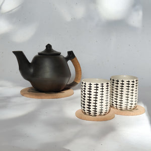 Eco cork hot pads with cactus print, perfect for sustainable living and table heat protection.