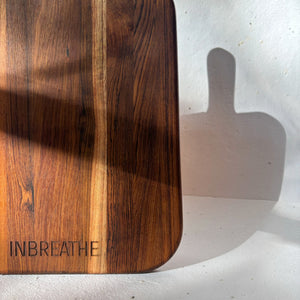 Close-up of eco-friendly teak wood cutting board showing smooth edges, rich grain, and premium finish for sustainable kitchens.