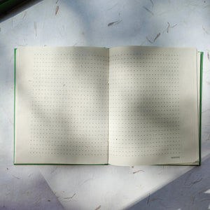 Open handmade dotted paper notebook with 5mm grid, with pink cover, ideal for planning, sketching, and journaling