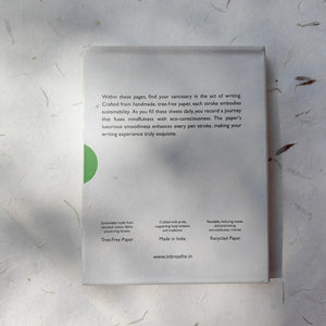 Handmade dotted paper notebook with pink cover, made from recycled cotton.