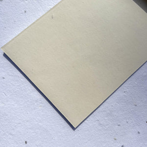 close detail of textured handmade writing paper from recycled cotton