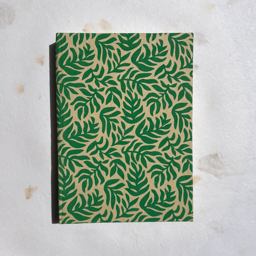 handmade paper notebook with green leaf design