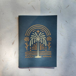 Front cover of InBreathe softcover notebook in blue, made with handmade tree-free paper
