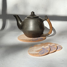 Load image into Gallery viewer, Natural cork trivets for sustainable kitchen use, perfect for protecting surfaces from hot cookware.
