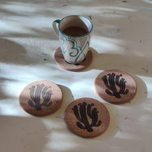 Load image into Gallery viewer, Recycled cork coaster set with hand-drawn cactus illustration for sustainable table settings.

