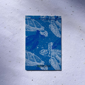 eco conscious handmade paper journal with turtle illustration