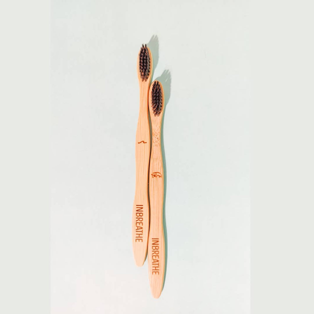 Set of 2 eco-friendly bamboo toothbrushes with charcoal-infused bristles by InBreathe