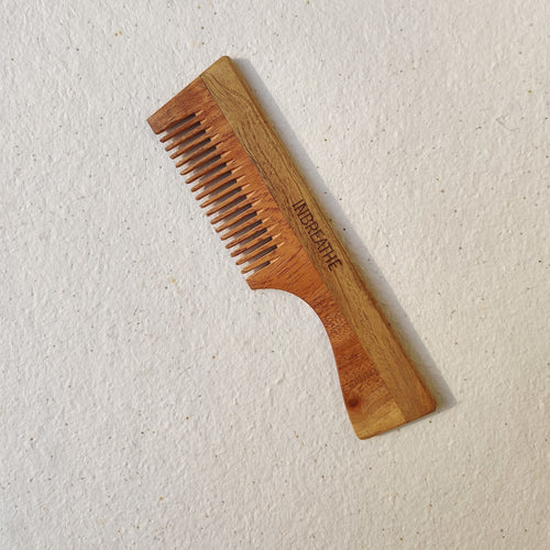Single neem wood hair comb with handle by InBreathe, made from antibacterial tree wood for gentle detangling.